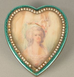 Silver heart shaped box, enameled in green with heart shaped portrait, surrounded by small pearls (6 missing). ht. 1 1/4 in., top: 3...