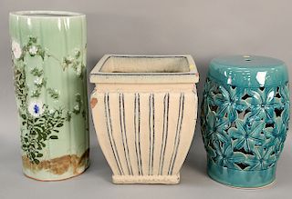 Seven large ceramic pieces to include three garden seats, pair of planters (as is), celadon glazed cane holder (as is), and a large ...