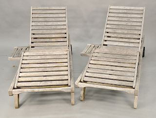 Three piece Barlow Tyrie teak outdoor lot to include pair of chaise lounges along with small table. lg. 77 1/2 in., table: ht. 15 3/...