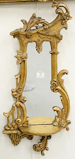 Pair of George II style giltwood girandole mirrors with shelf. ht. 30 in., wd. 14 in. Provenance: From the Estate of Deborah G. Blac...
