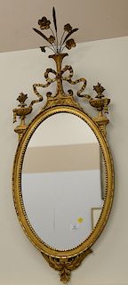 Two mirrors including a custom mahogany mirror (41" x 21 1/2") and an oval gilt mirror (47" x 16").