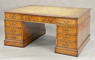 George IV burlwood partner's desk having tooled leather top and custom glass top, 19th century (3 inch chip on bead molding). ht. 32...