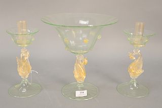 Three piece Venetian glass set to include a compote (ht. 10 1/4 in., and a pair of candlesticks with figural swan base green & gold ...