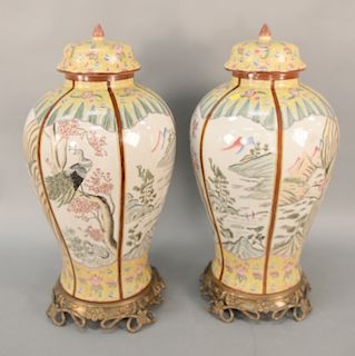 Pair of large Chinese style porcelain urns on metal bases. ht. 27 1/2 in. Provenance: From the Estate of Deborah G. Black of Greenwi...