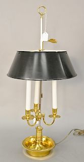 French brass bouillotte table lamp with adjustable tole shade. ht. 29 in. Provenance: An Estate from Farmington, Connecticut