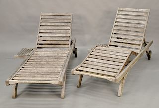 Pair of Barlow Tyrie teak outdoor chaise lounges. lg. 78 in. Provenance: From the Estate of Deborah G. Black of Greenwich, Connecticut