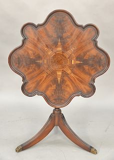 Mahogany shaped tip table with star inlay. ht. 29 1/2 in., dia. 30 in.