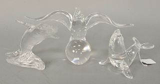 Three glass sculptures to include Steuben bird on ball with wings spread (ht. 7 in.), Steuben Seal (ht. 5 in.), and a Waterford whal...