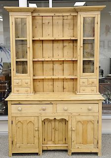 Large pine hutch with open shelves above two frieze drawers and panelled doors. ht. 86 1/2 in., wd. 57 in., dp. 21 in. Provenance: F...