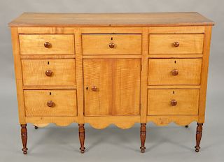 Sheraton maple and tiger maple sideboard/server having one drawer over one door flanked by three drawers on either side, circa 1830....