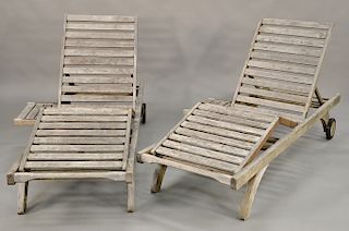 Pair of Barlow and Tyrie chaise lounges. lg. 77 1/2 in. Provenance: From the Estate of Deborah G. Black of Greenwich, Connecticut