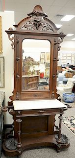 Two Victorian walnut hall racks (81 in., wd. 28 1/2 in.), one with marble top *ht. 93 in., wd. 47 in.).