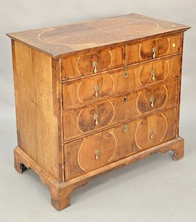 William and Mary walnut two over three drawer chest, top with panel of burlwood, early 18th century. ht. 36 in., case wd. 36 1/4 in....