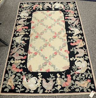 Four throw rugs including three hooked and one needlepoint. (2'6" x 4'6"), (2'2" x 3'5"), (2'10" x 4'), & (3'5" x 5'4")