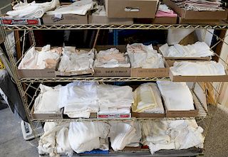 Large group of linens including table clothes, napkins, etc.