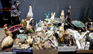 Large group of animal figurines including ceramic bunny rabbits, Majolica roosters, carved wood cows, porcelain, etc. Provenance: Fr...