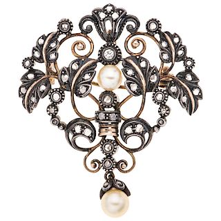 A cultured pearl and diamond 18K yellow gold and silver pendant/brooch.