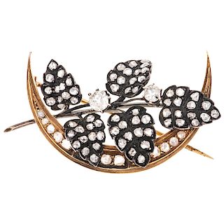 A diamond 18K yellow gold and silver brooch.