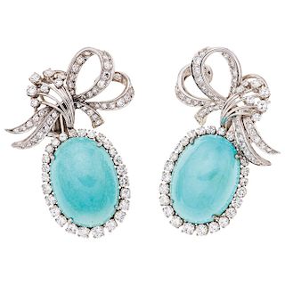 A turquoise and diamond 14K white gold pair of earrings.