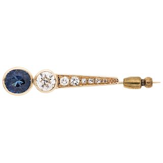 A sapphire and diamond 14K yellow gold stick pin.