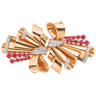 A ruby and diamond 18K rose gold brooch.