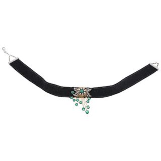 An emerald and diamond 14K yellow and white gold pendant with velvet choker.