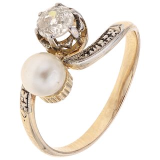 A diamond and cultured pearl 14K yellow gold ring.