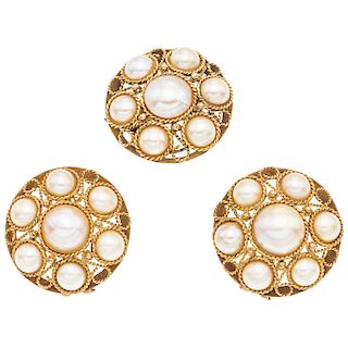 A half pearl 14K yellow gold ring and pair of earrings set.