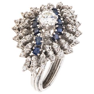 A diamond and sapphire 14K white gold ring.
