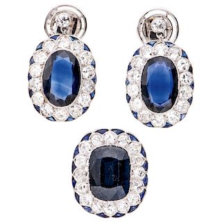 A sapphire, simulant and diamond 14K white gold pendant and pair of earrings set.