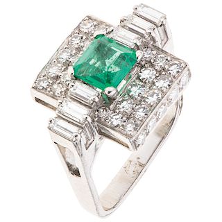An emerald and diamond 14K white gold ring.