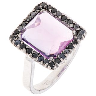 An amethyst and sapphire 14K white gold ring.