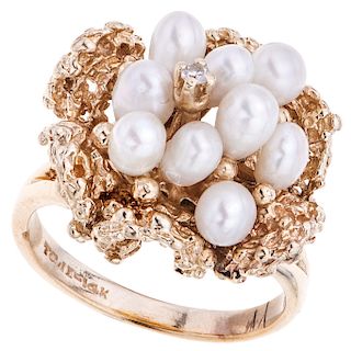 A cultured pearl and diamond 14K yellow gold ring.