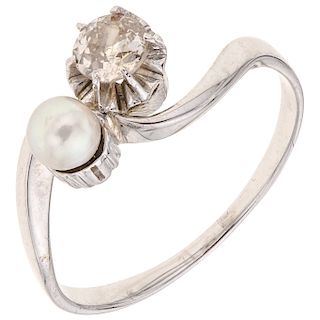 A diamond and cultured pearl 14K white gold ring.