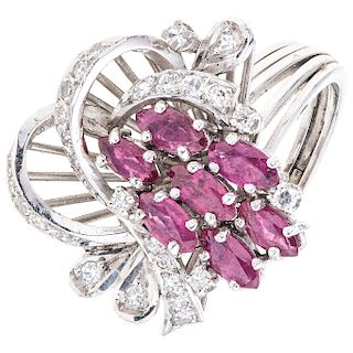 A ruby and diamond palladium silver ring.
