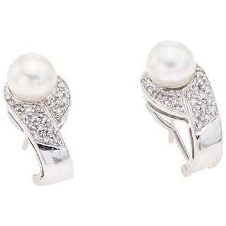 A cultured pearl and diamond 14K white gold pair of earrings.