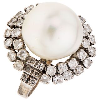 A cultured pearl and diamond palladium silver ring.