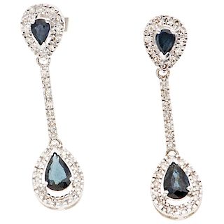 A sapphire and diamond 14K white gold pair of earrings.