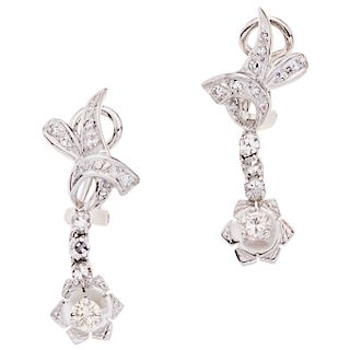 A diamond 10K white gold pair of earrings.