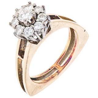 A diamond 14K yellow gold and palladium silver ring.
