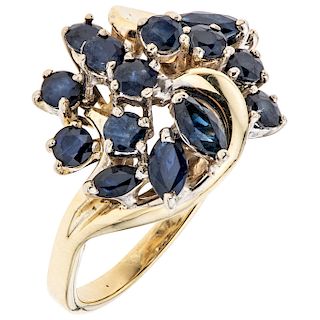 A sapphire 14K yellow gold ring.