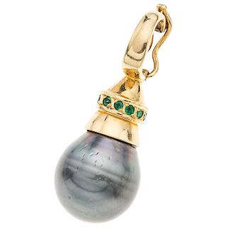 A cultured pearl and emerald 18K yellow gold pendant.