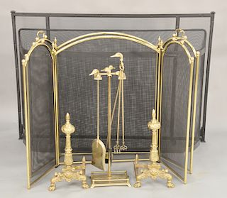 Group of fireplace equipment to include four fire screens, a pair of andirons (ht. 18 in.), and a set of brass tools having duck heads.
