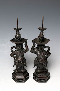 PAIR OF BRONZE GUARDIAN CANDLE PRICKETS