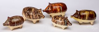 Five pottery or earthenware pig banks