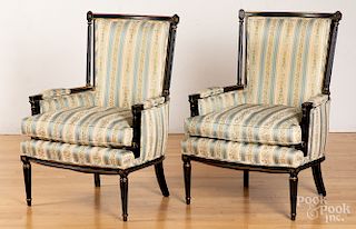 Pair of French style ebonized armchairs.