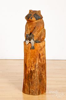 Carved tree trunk racoon
