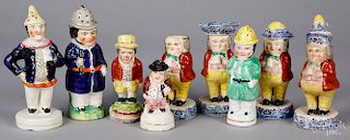 Nine Staffordshire shakers and condiment holders