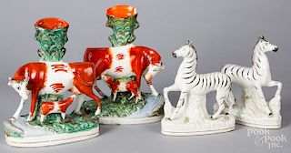 Pair of Staffordshire cow spill vases, etc.