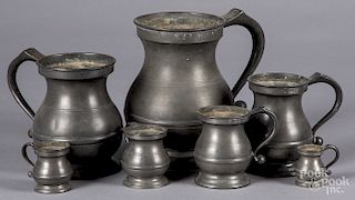 Seven graduated English pewter measures